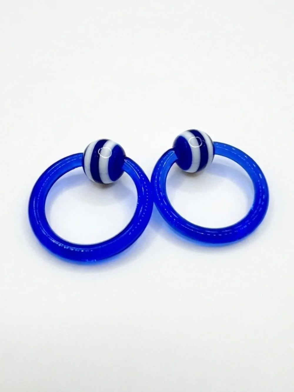 12g 7/16 Captive Bead Ring Pr Blue w/ Blue & White Striped Beads